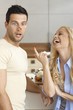 Young couple having fun in kitchen