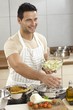 Young man in kitchen