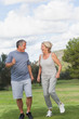 Mature woman and man jogging together