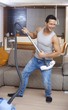 Photo: Young man having fun at home Young man having fun at home