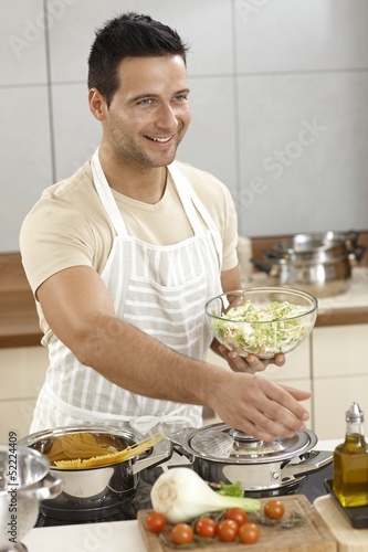 Photo: Young man in kitchen Young man in kitchen