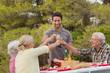 Family toasting each other at lunch