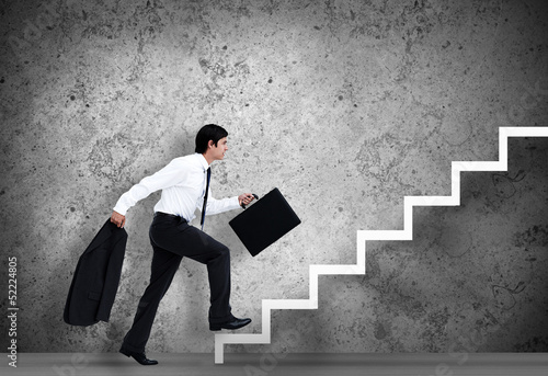 Photo: Businessman climbing the stairs to the top Businessman climbing the stairs to the top