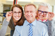 Foto: Family buying new glasses at optician Family buying new glasses at optician