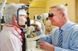 Ophthalmologist examing senior woman
