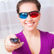 Photo: young girl watching 3d television young girl watching 3d television