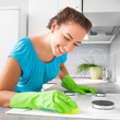 woman cleans the kitchen