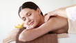 happy woman relaxing in spa salon