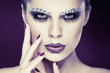 Photo: sexual beautiful girl with strasses on face, on a violet sexual beautiful girl with strasses on face, on a violet