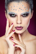 sexual beautiful girl with strasses on face, on a violet 
