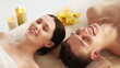 happy couple relaxing in spa salon