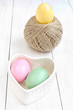 Easter egg in a heart shaped box and  ball of hemp rope