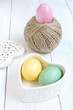 Easter egg in a heart shaped box and  ball of hemp rope