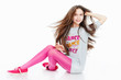 Pretty teenage girl sitting on the floor