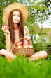 Beautiful woman in the garden with apples