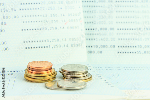 Photo: Coins on account passbook Coins on account passbook