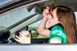 Pretty young woman applying makeup, speaking on phone and drinki