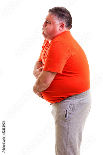 Photo: Overweight man with strong stomach pain Overweight man with strong stomach pain