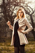 Photo: young woman in autumn garden young woman in autumn garden