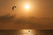 Kite surfer jumping from the water