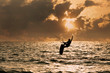 Kite surfer jumping from the water