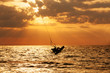 Kite surfer jumping from the water