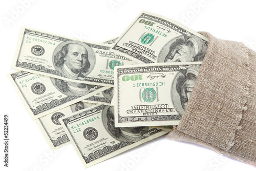 Photo: Hundred dollar bills in a canvas sack isolated on white backgrou Hundred dollar bills in a canvas sack isolated on white backgrou