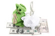 Piggy bank on the bills of American dollars isolated against whi