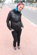 Redhead young pretty woman posing, outside