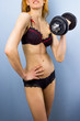 Sexy underwear model with dumbbell