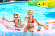 Child on water slide at aquapark.