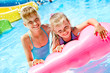 Child on water slide at aquapark.