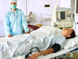 Patient on gurney in operating room.