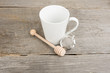 White cup on wood table