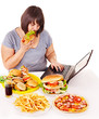Woman eating junk food.