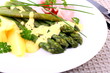 Green asparagus with prosciutto, potato and sauce