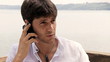 Handsome business man talking on the phone
