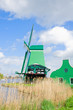 dutch windmills over  river