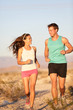 Foto: Runners - Active fitness couple running laughing Runners - Active fitness couple running laughing