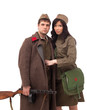 Attractive man and woman posing in khaki
