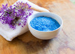 Sea salt in bowl on wooden background