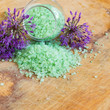 Green sea salt on wooden background