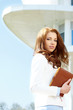 Attractive business women over modern street background