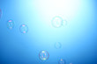 Foto: Soap bubbles on blue background Soap bubbles on blue background