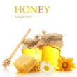 Jars of honey and honeycombs isolated on white
