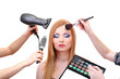Beautiful young woman and hands with eyes shadows, brush and