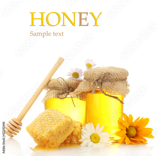 Photo: Jars of honey and honeycombs isolated on white Jars of honey and honeycombs isolated on white