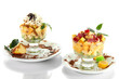 Fruit salad in a sundae dish isolated on whit