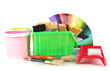 Paint pots, paintbrushes and coloured swatches isolated on