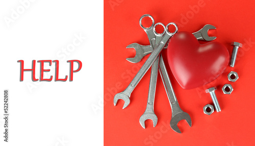 Photo: Reconstruction of heart tools on color background Reconstruction of heart tools on color background
